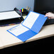 A person's hand holding a light blue Universal paper pocket folder with white paper inside.