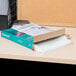 A package of Avery sheet protectors on a desk.