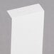 A white rectangular piece of paper with a curved edge.