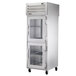 A silver True Spec Series pass-through refrigerator with half glass doors.