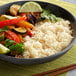 A bowl of Royal Jasmine white rice with vegetables.