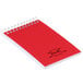 A red National wirebound memo book with spiral binding.
