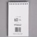 A white wirebound National memo book with a barcode on it.