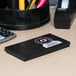 A black rectangular object with a white label.
