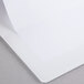 A white paper in a Universal White Deluxe View Binder.