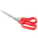 A close-up of Universal stainless steel scissors with red bent handles.