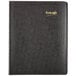 Brownline black 2024 EcoLogix monthly planner with a spiral bound cover.