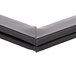 A close-up of a black plastic corner on a Delfield door gasket.