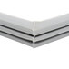 A close-up of a gray plastic corner of a white Delfield door gasket.