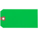 A green tag with a brown circle and white border.