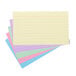 A stack of Universal assorted color ruled index cards.