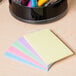 A stack of Universal 3" x 5" assorted color ruled index cards.