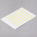 A white paper with yellow lines.