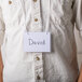 A man wearing a Universal neck lanyard with a name tag holder.