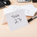 A white Universal unruled index card with black writing next to a pen and calculator.