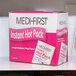 A pink and white box of Medique instant hot packs on a shelf.