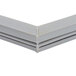 A close up of a gray corner piece of a Delfield equivalent door gasket.