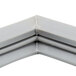 A close up of a gray corner piece on a white background.