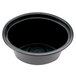 A black plastic Pactiv oval souffle bowl with a black lid.