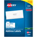 A blue and yellow package of Avery white mailing address labels with 100 sheets.