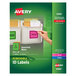 A hand holding a green and white pack of Avery Removable ID Labels with colorful labels inside.