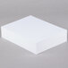 A stack of Neenah Bright White Cardstock paper.