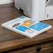 A white box of Avery rectangular laser address labels on a desk.