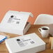 A white box of Avery Mailing & Shipping Labels with a label on it.