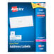 A blue box of white Avery mailing address labels.