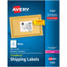 A package of Avery white rectangular shipping labels with a blue and white box.