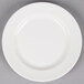 A white Reserve by Libbey porcelain plate with a wide rim on a gray surface.