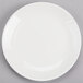 A white porcelain coupe plate with a white rim.