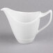 A white Royal Rideau porcelain creamer with a handle.