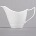 A white pitcher with a handle.