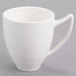 A white mug with a handle.