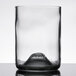 A clear Arcoroc wine tumbler with a black rim.