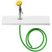 A green hose with a metal connector attached to a white surface.