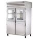 A large stainless steel True pass-through refrigerator with half glass front doors and solid back doors.