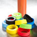 A group of Tablecraft silicone squeeze bottle bands in different colors.