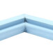 A blue corner piece with a small hole in a Delfield magnetic door gasket.