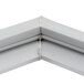 A close-up of a white corner piece of a Delfield 1702640 equivalent magnetic door gasket.