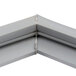 A close-up of a gray corner of a white Delfield equivalent magnetic door gasket.