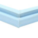 The white plastic corner of a Delfield magnetic door gasket with blue and green accents.