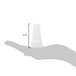 A hand holding a white plastic cone with a white plastic cap on it.