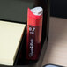A white surface with a red Paper Mate pencil lead refill package on it.