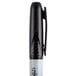 A Universal black pen with a black cap and bullet tip.