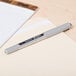 A Uni-ball Vision pen on a notepad.