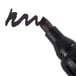 A close-up of a Universal black chisel tip permanent marker.