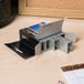 A box of Swingline 210 strip count heavy-duty staples on a table.