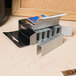 A box of Swingline 210 strip count heavy-duty chisel point staples on a table.